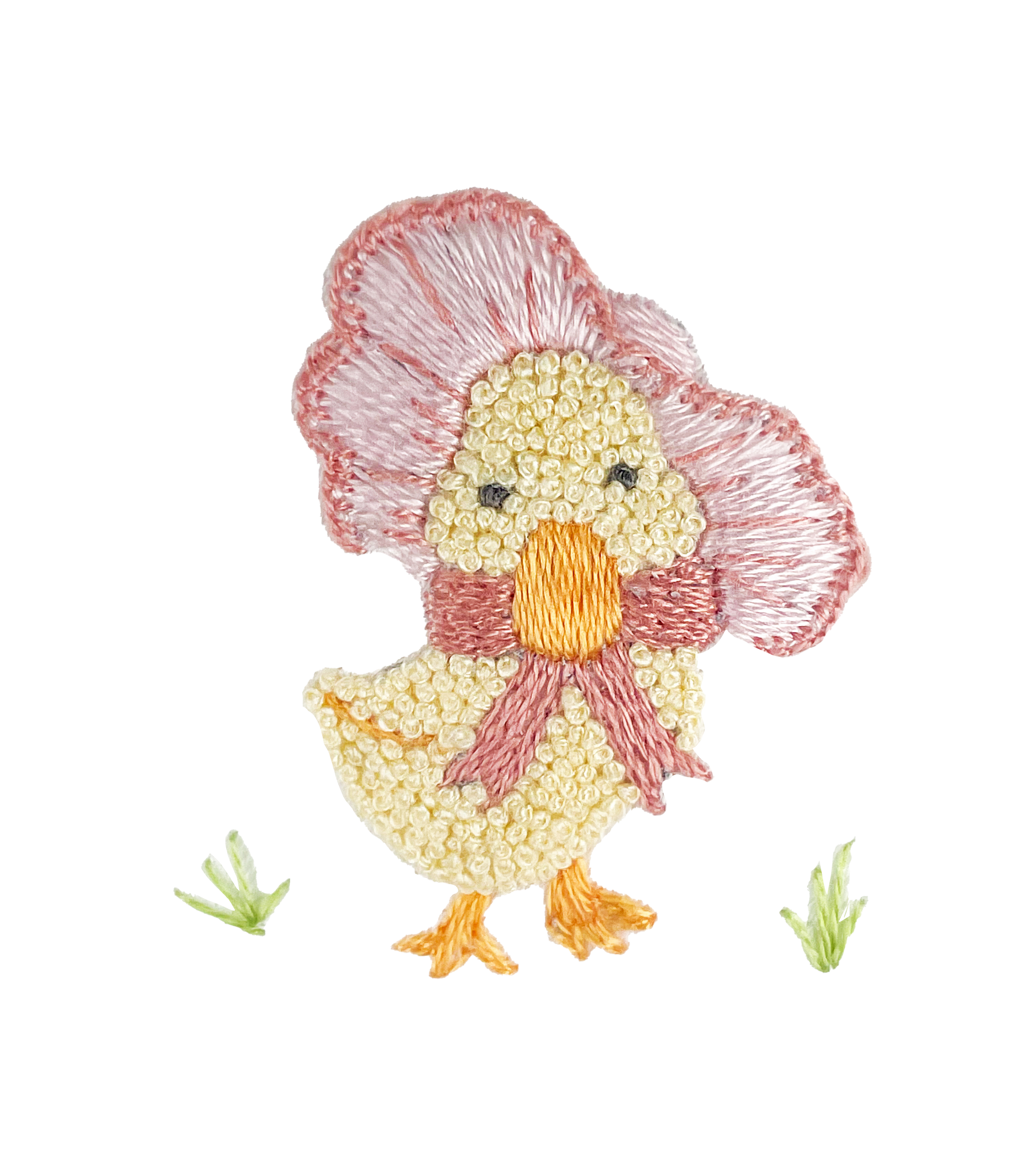 A white converter gown for babies with a hand-embroidered design of a baby duck wearing a bonnet.