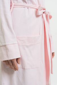closeup details of pink fabric and belt