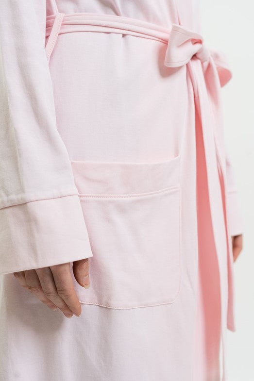 closeup details of pink fabric and belt