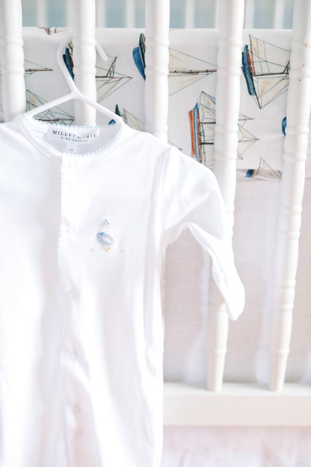 Newborn converter hanging on baby bed