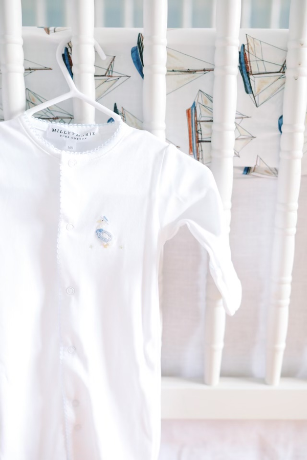Newborn converter hanging on baby bed