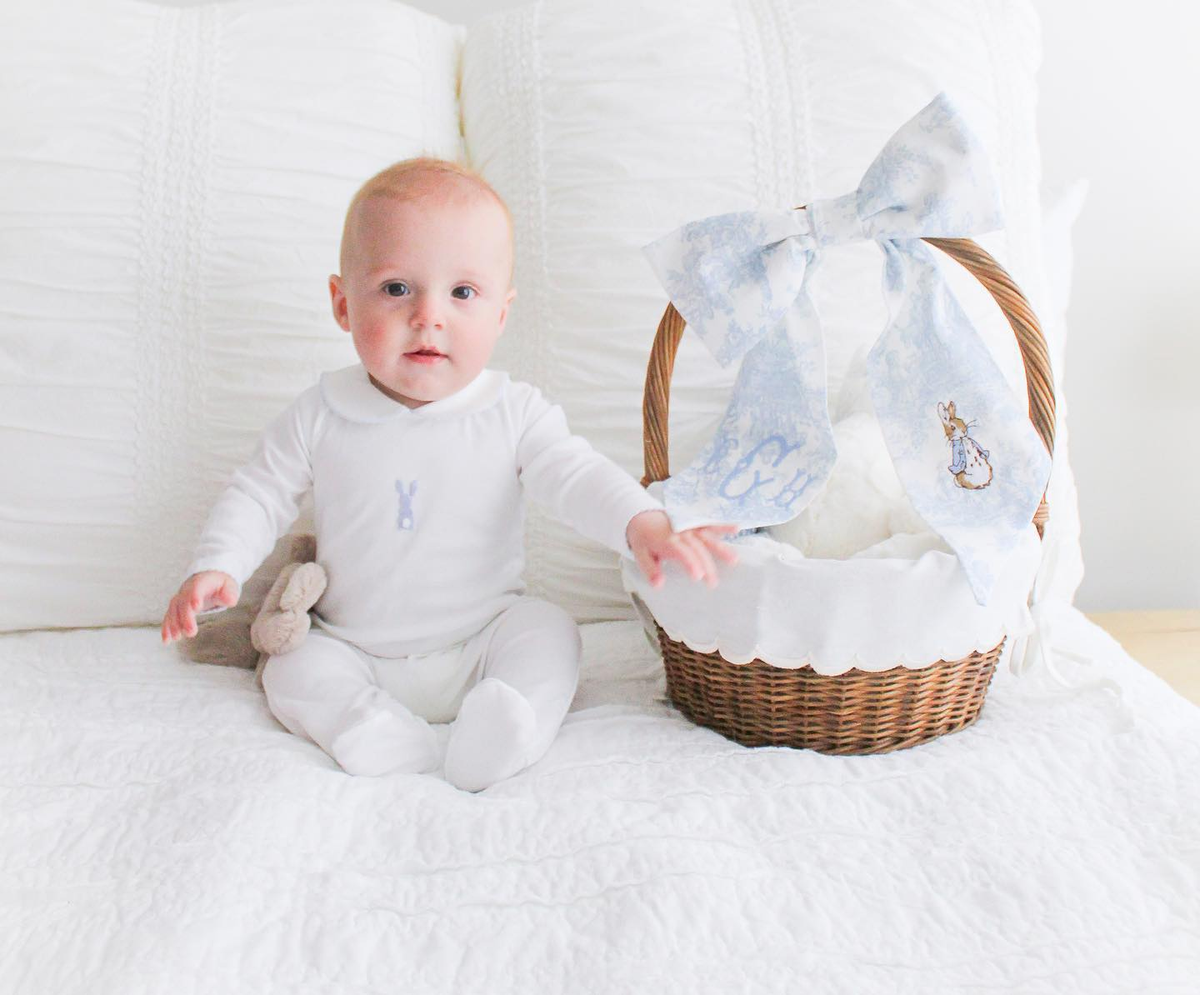 Baby wearing footie with bunny