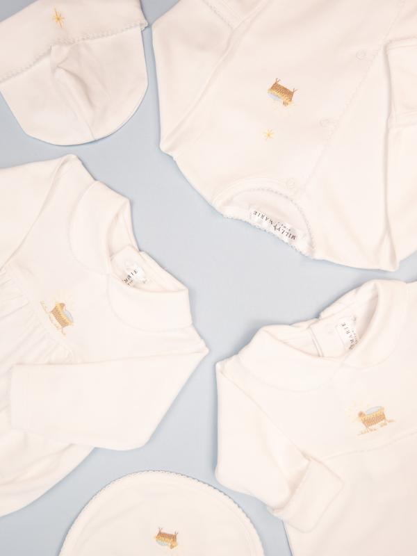 Hand embroidered white pima cotton layette 