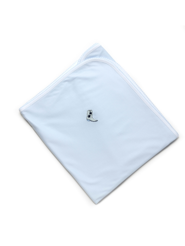 A light blue baby blanket with a small embroidered cowboy boot in the corner, laid flat on a white background.