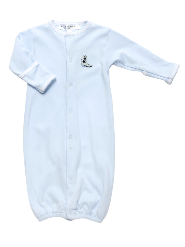 A light blue baby gown with a hand embroidered cowboy boot on the chest, trimmed with delicate blue picot, and snaps from neckline to foot.