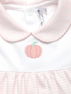 Children's outfit with pink collar and embroidered pumpkin on a white background