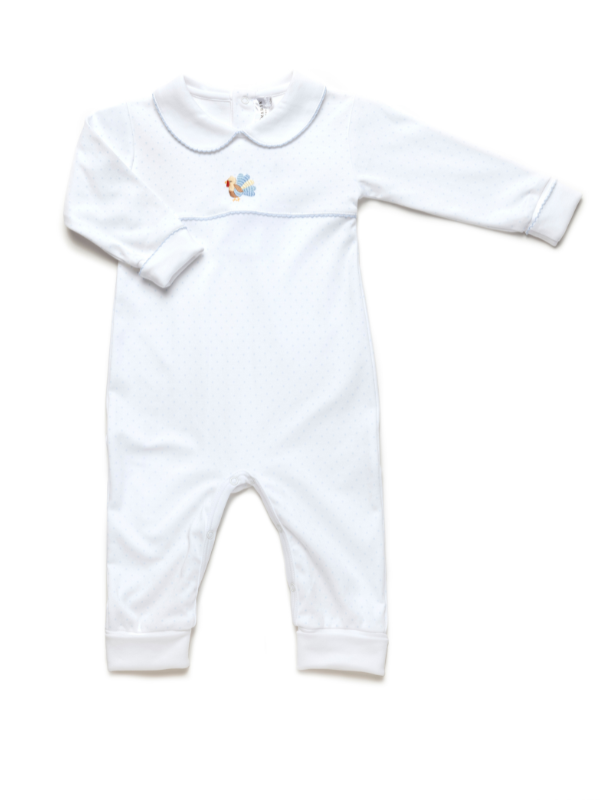 White baby onesie with a small design on a white background