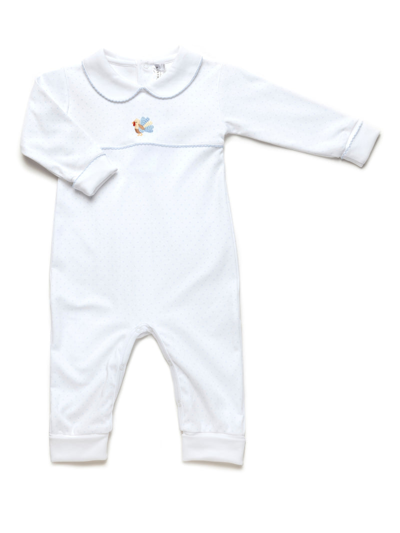 White with blue dots baby playsuit with a hand embroidered turkey design on a white background