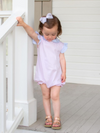 Little girl on porch wearing pima cotton pink bubble outfit